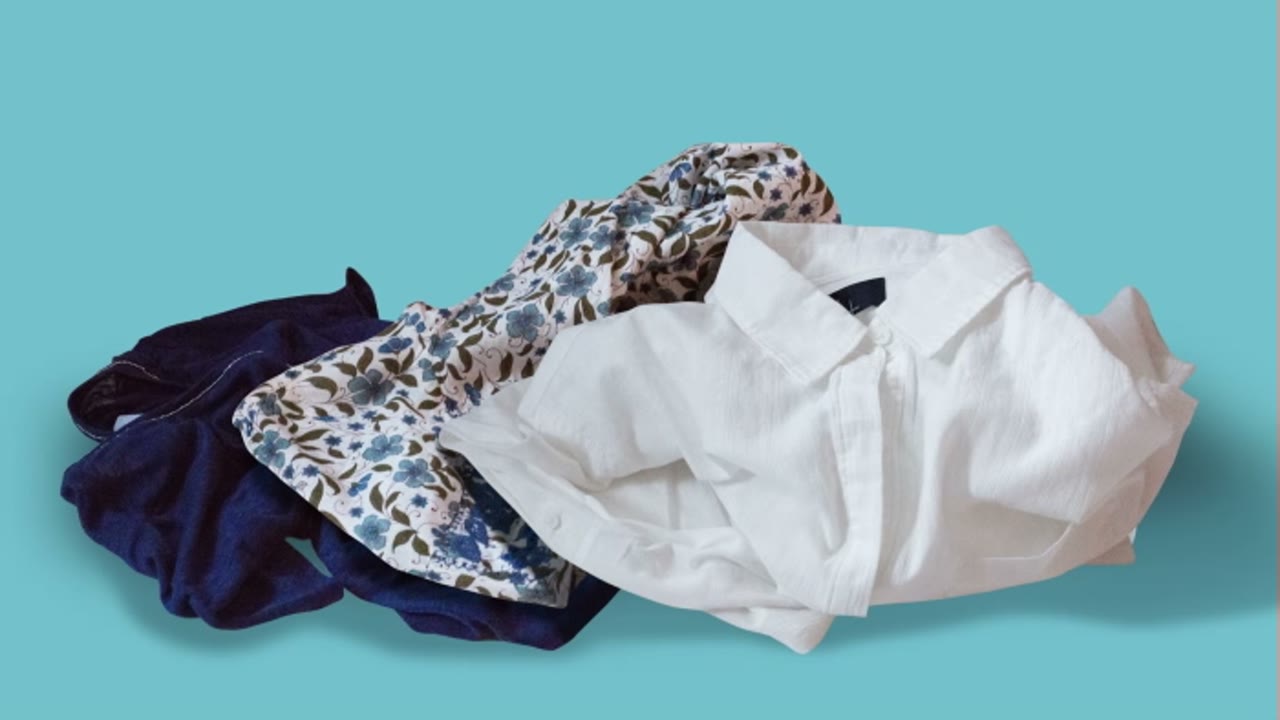 The Big Spring Clean: a pile of folded clothing scattered on a teal background