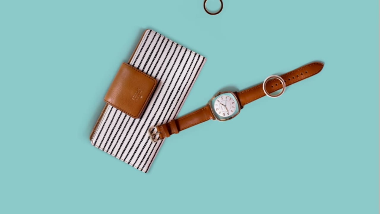 The Big Spring Clean: a striped wallet and passport holder beside a watch