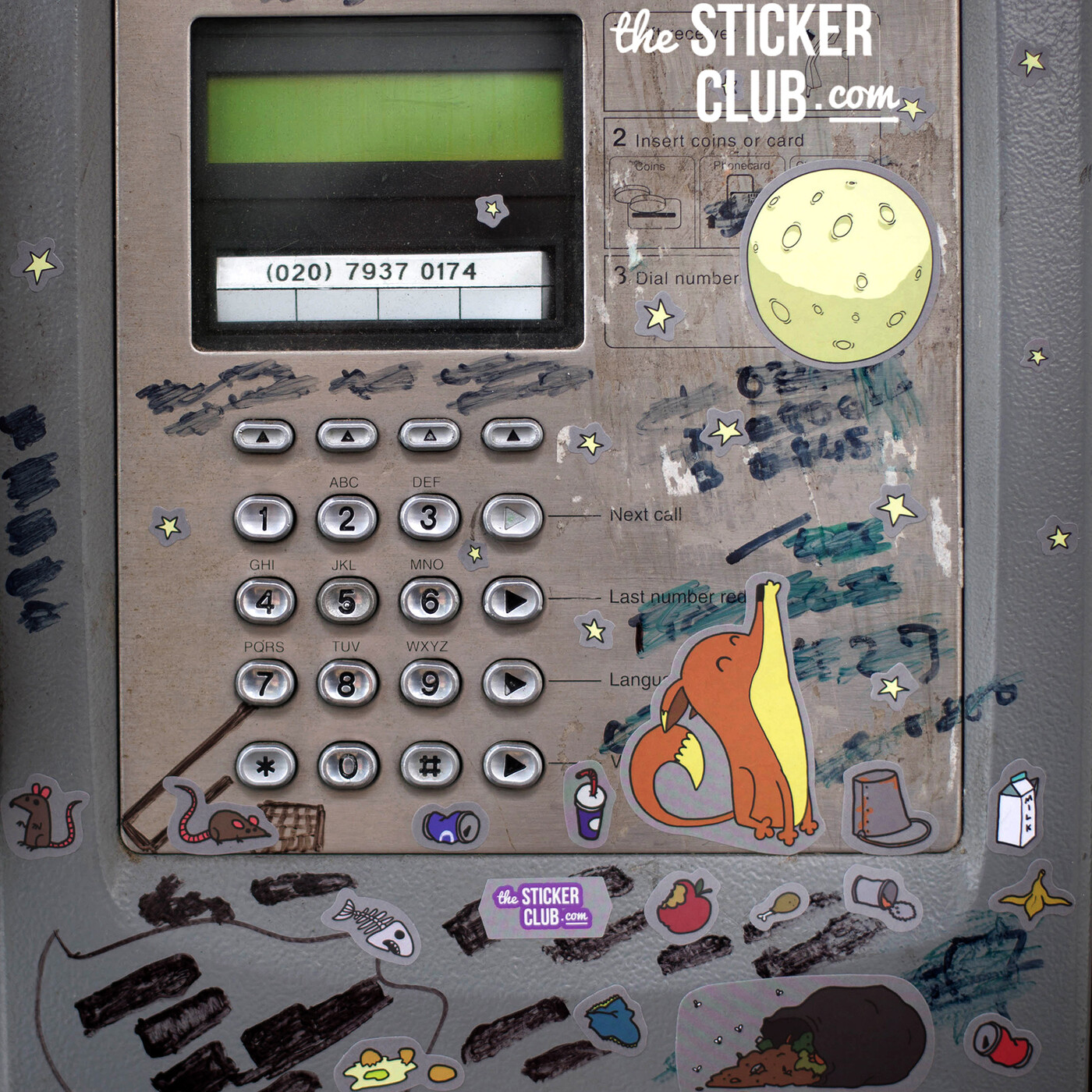 The Sticker Club stickers on a London payphone unit, showing a real central-London phone number