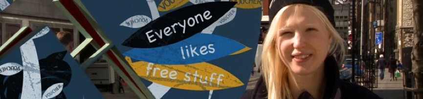 Visa Loyalty Programme — "Everyone likes free stuff", a loyalty-voucher graphic over a real street photograph, from the archive page's own hero image
